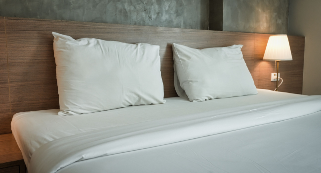 menu d'oreillers et couettes proposé aux clients d'un hôtel pour personnaliser leur literie